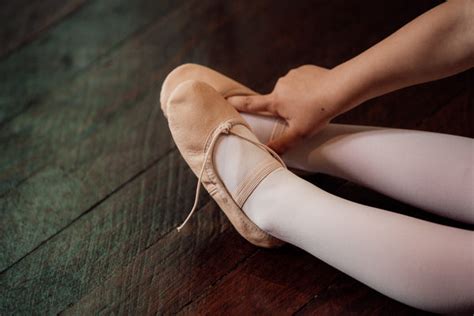 how should ballet shoes fit; what is the role of a ballerina's smile in the performance?